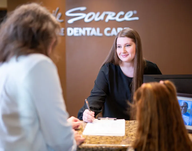 woman scheduling a dental appointment at north Spokane dental office Smile Source Spokane